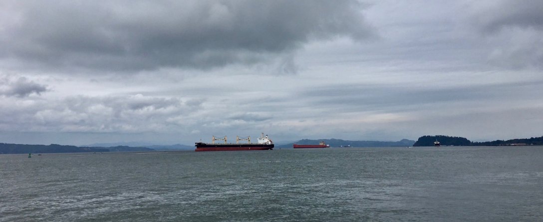 Cargo ships on the Columbia River Astoria Oregon waterfront