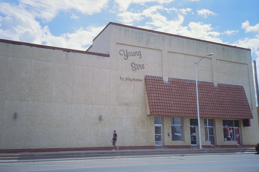 Expired Kodak Elite Chrome 35mm expired film photograph Young Sirs by playmates Department Store in Clovis, New Mexico
