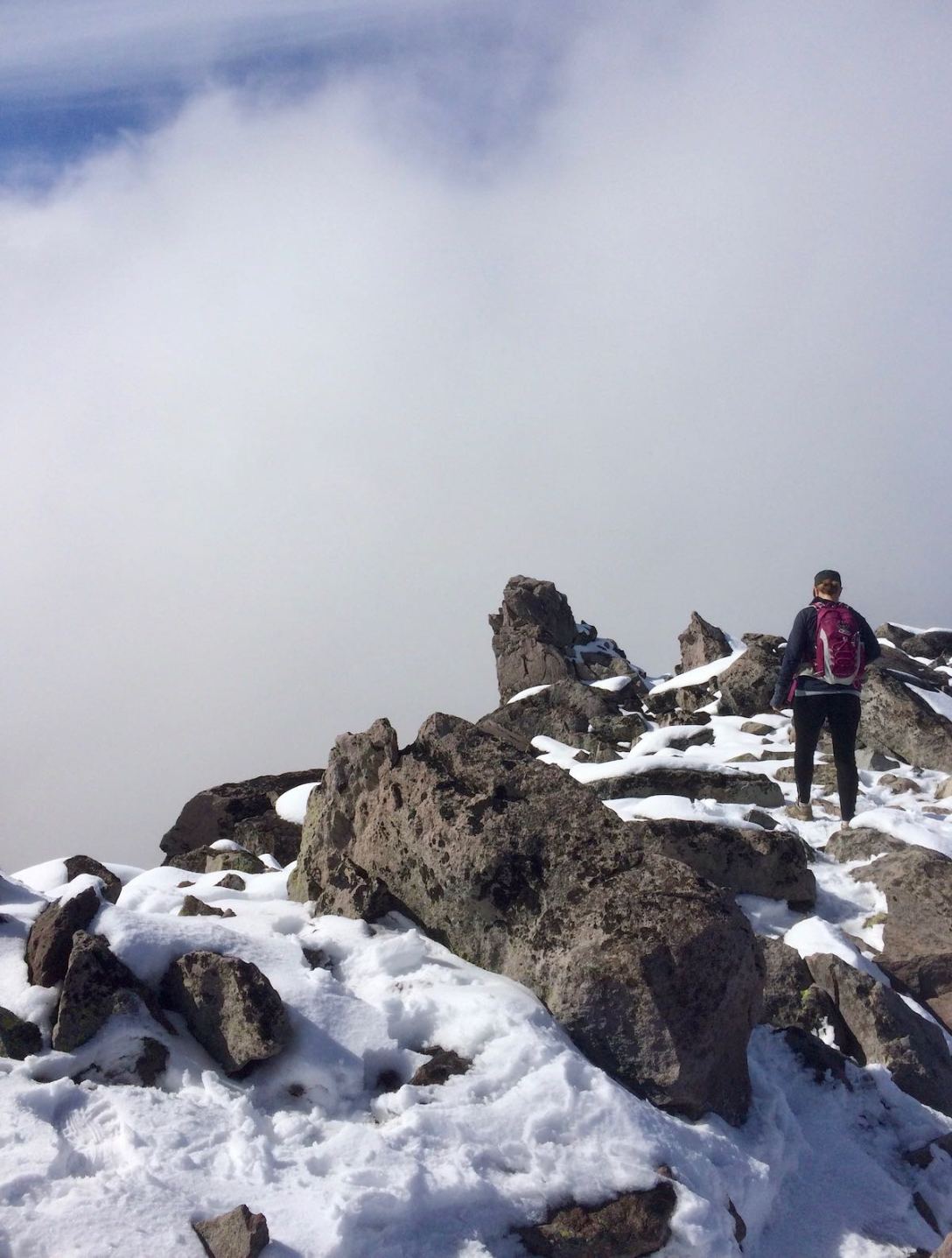 Maneuvering through the boulders and snow atop Third Burroughs