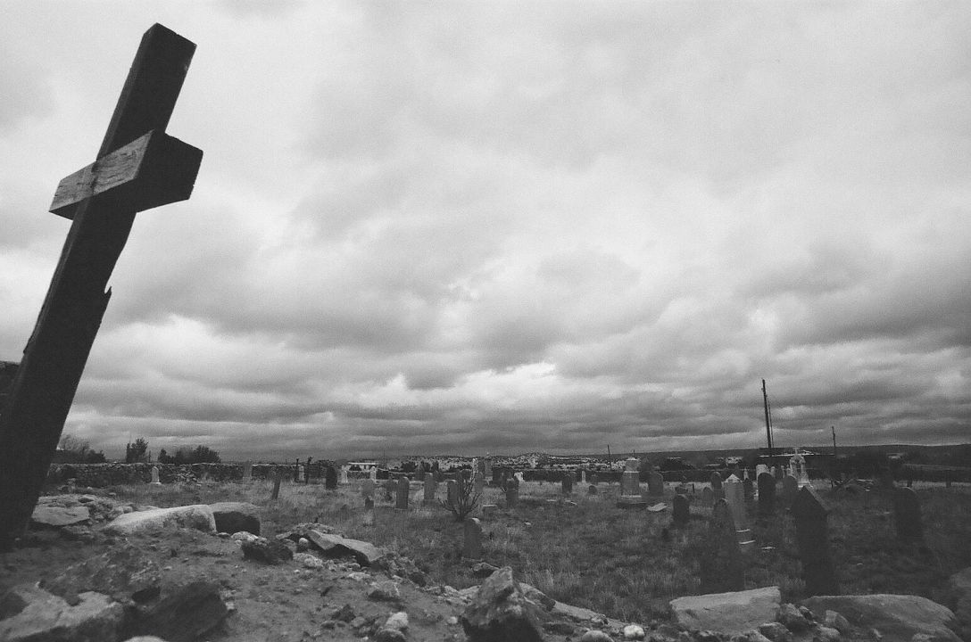 35mm black and white film photograph - Old walled cemetery in Galisteo, New Mexico