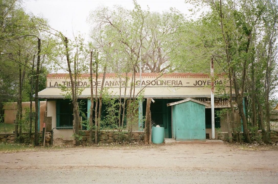 35mm film photograph of abandoned jewelry store and gas station in Galisteo, New Mexico