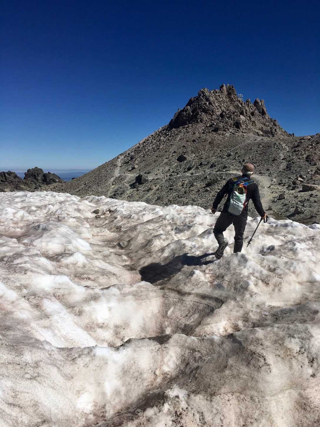 Hiking through the glacier toward the summit of Lassen Peak in Lassen Peak Volcanic National Monument