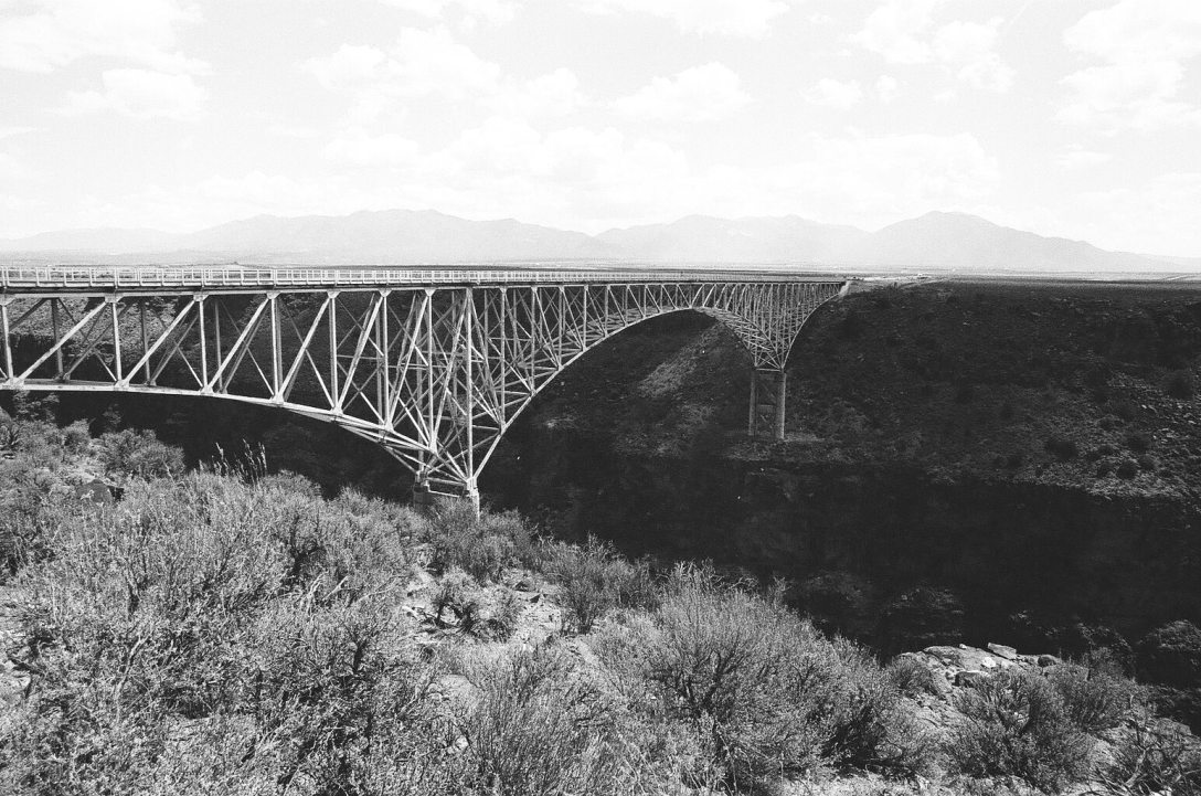 Monochrome 35mm Kodak Tri-X 400 film photograph of Rio Grande Gorge Bridge near Taos, Rio Grand Del Norte National Monument